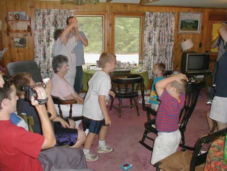 Maine14_JonHeweyBlowingOutFamilyCandles