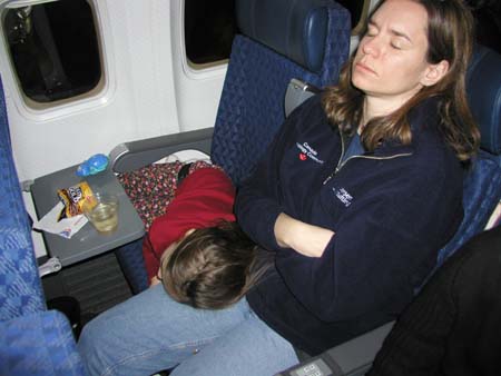 SkiTrip2004CG_SquirtleSydneyAndTammyNappingOnFlightHome